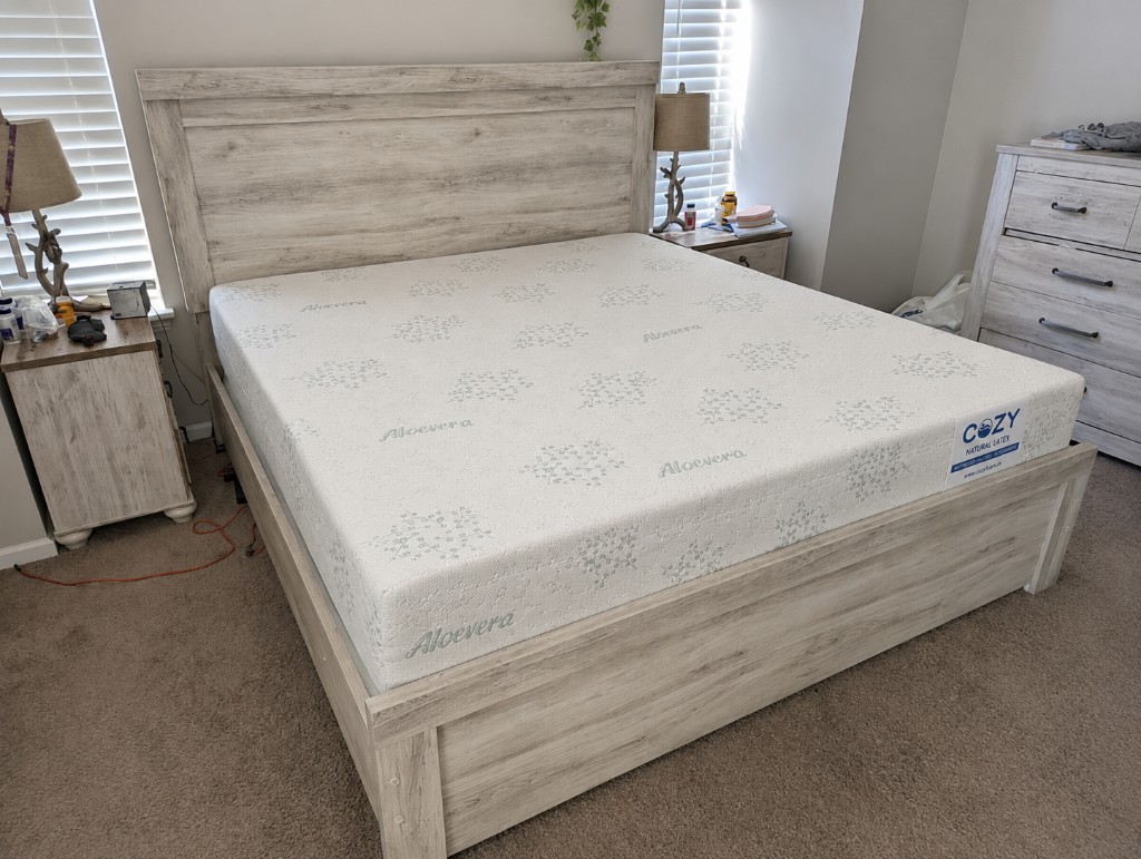 CozyFoam Natural Latex mattress on a wooden bed frame in a customer home